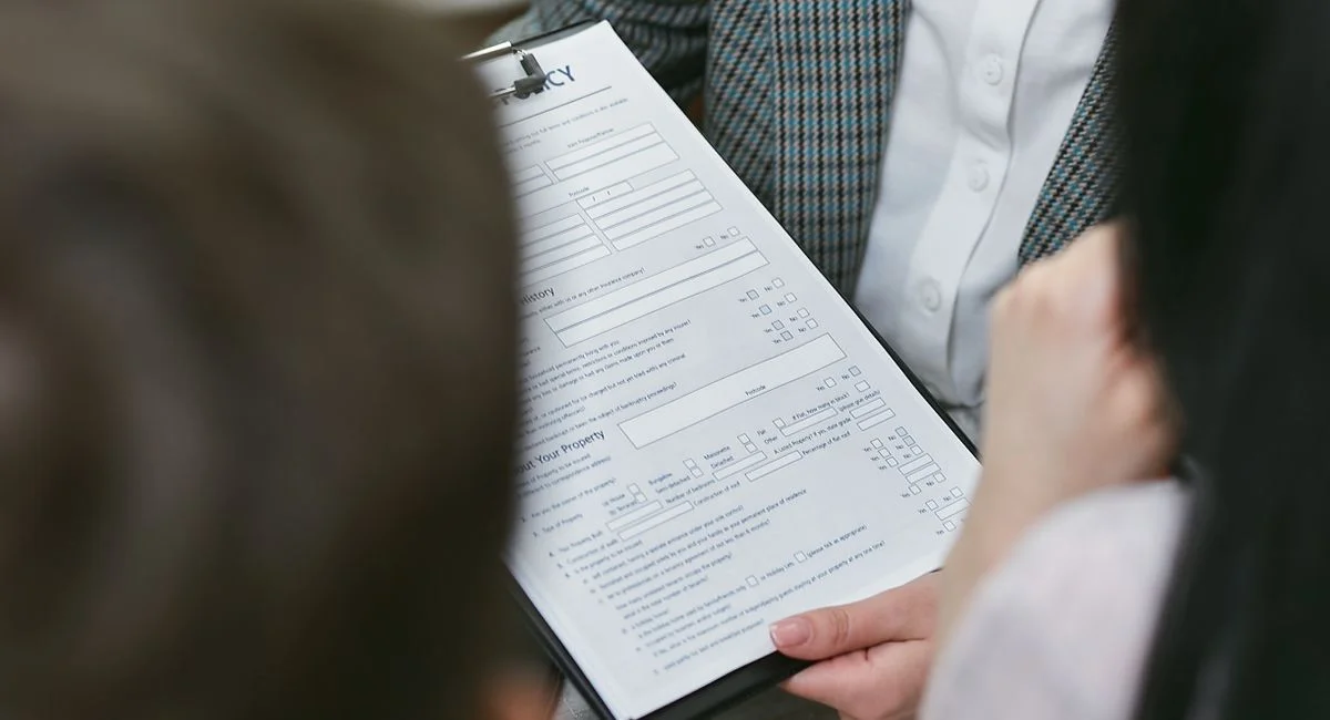 Close-up of professionals discussing a legal contract during a business meeting.