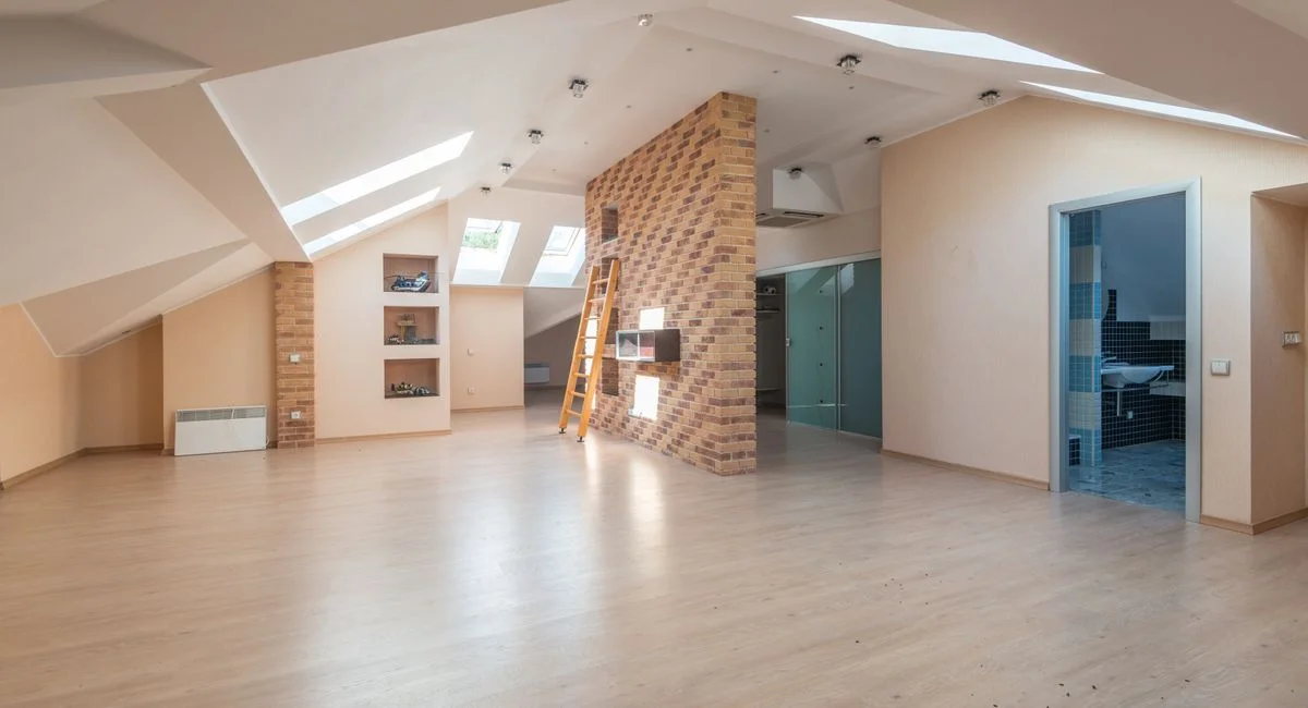 Explore this bright, spacious modern attic apartment with skylights and contemporary design.
